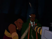 Ubu throwing a dagger at Batman