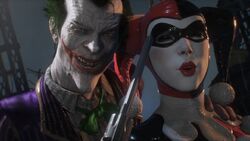 Joker holding Harley Quinn hostage 