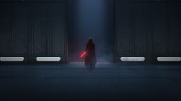 Darth Vader entering the hangar with his blade drawn.