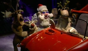 Blitzen with Robbie, Santa and Prancer with the new sleigh.