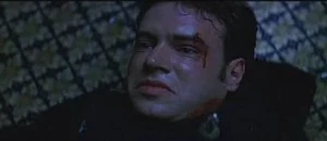 Roman being stabbed by Sidney.