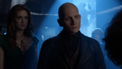 Zsasz with Ivy at the club opening