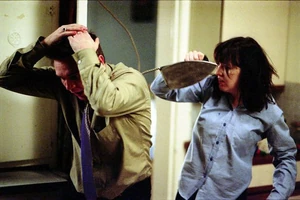 Trevor gets attacked by Little Mo with an iron on the stroke of midnight celebrating New Year's Day 2002.