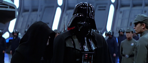 The Emperor walks with Darth Vader.