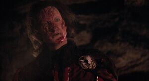 The Phantom's horribly disfigured face.
