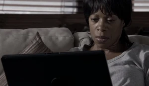 Beckett using her laptop to communicate with Russell.