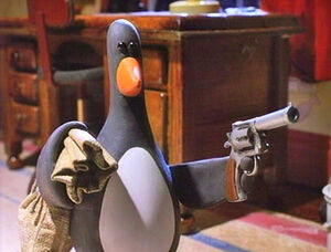 Feathers holding his weapon at Gromit.