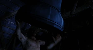 Hyde picking up the bell and sees Van Helsing crouched up inside and swings a blade chopping off Mr. Hyde's arm.