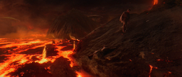 Vader lays on the black sand shores of Mustafar.