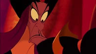 Jafar noticing Aladdin's reflection in Jasmine's crown, realizing he has been deceived and distracted.