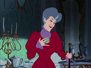 Lady Tremaine reprimanding her daughters when they start fighting over the glass slipper.