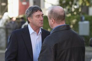 Phil Mitchell feuding against his family's sworn enemy and crime boss Johnny Allen.