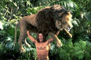 George of the Jungle lifting a Lion