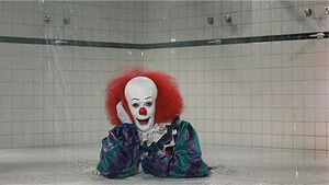 Pennywise in the shower, terrifying Eddie.