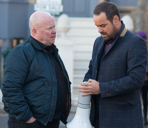 Phil Mitchell squaring up against Shirley's beloved son Mick Carter, also the pub's recent landlord.