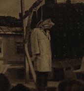 Felix Harmon being hanged in public before being saved by the Court of Owls.