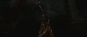 Red Pyramid throwing Anna's flayed skin at the church doors.