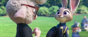 Bellwether giving Judy her police badge.