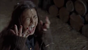 Gina having acid thrown on her face.