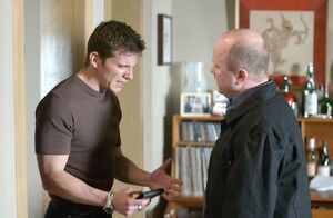 Phil and Dennis argue in the aftermath of Dalton's murder.