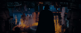 Vader enters the carbon-freeze chamber with Fett and a squad of stormtroopers.