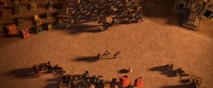 Chakal stares at Manolo and San Ángel.