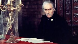 Dracula about to sign the contract.