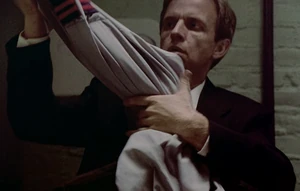 Gerald Demus Disguise.jpg (325 KB) Demus pulling out a security guard disguise.