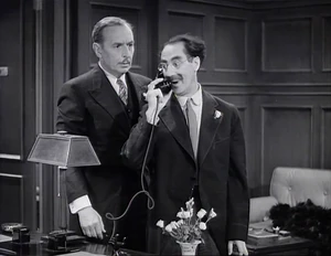 Grover with Flywheel answering the former's phone