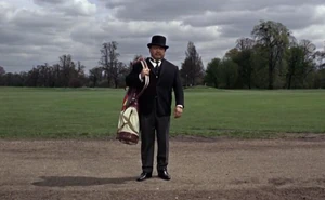 Oddjob as Goldfinger's caddie.