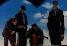 The guy in the far right is the Tiger Gang Member and the other two are his henchmen while the guy with the guy is the hostage