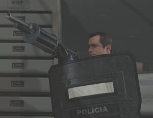 Becker firing the grenade launcher.