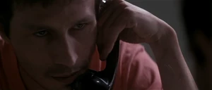 Korda (being imprisoned) speaking on the phone to Teal