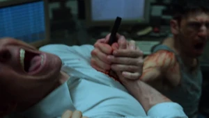 The Punisher stabs Agent Orange.