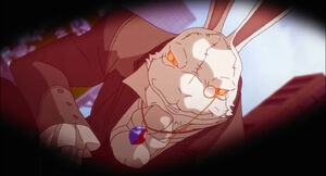 The White Rabbit kneeling over Dante.