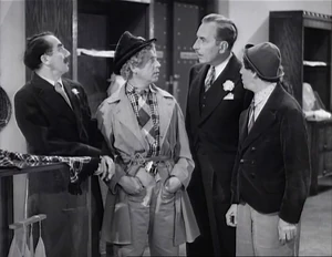 Grover scolding Flywheel, Ravelli, and Wacky for their antics involving accidentally destroying priceless antiques earlier, insulting customers, and disturbing the general routine