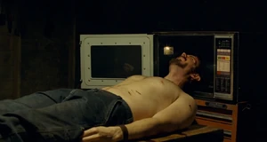 Krug's defeat, moments before his head explodes in a microwave oven