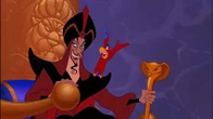 Jafar finding Iago's idea to be intriguing while briefly sitting on the Sultan's throne.