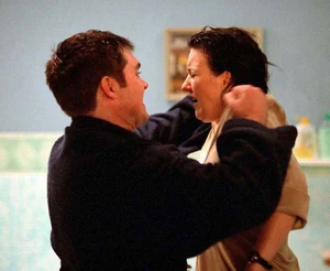 Trevor forcefully strips Little Mo as he prepares to rape her (December 2001).