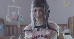 Cry Baby in the video for the eponymous song #1