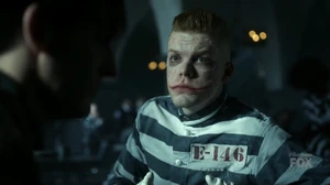Oswald talks to Jerome in Arkham Asylum.