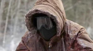 Judith eyes Mark before running him over with a snowmobile.