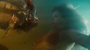 An adult piranha getting killed by a litter trident before it was able to attack Maddy.