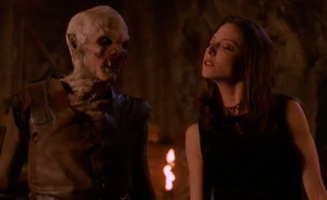 Thefirstdru.png (125 KB) The First Evil in the form of Drusilla (right) with a Turok-Han vampire (left).