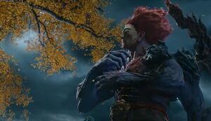 Lord Redmane standing in front of the tree