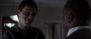 Korda meeting Lieutenant Sam Baffett in his apartment.