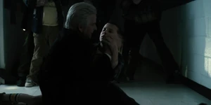 After several of his agents sneak up and apprehend the boys, Brenner goes to cradle Eleven's unconscious body.