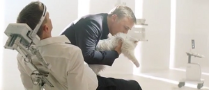 Blofeld petting his white cat as he surgically tortures Bond.