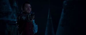 Gaston pointing his pistol at the Beast again before he fatally shoots the Beast at the back.