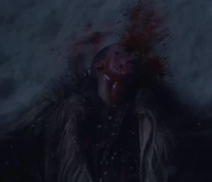 Paul lies dead in the snow after being shot to death by John.